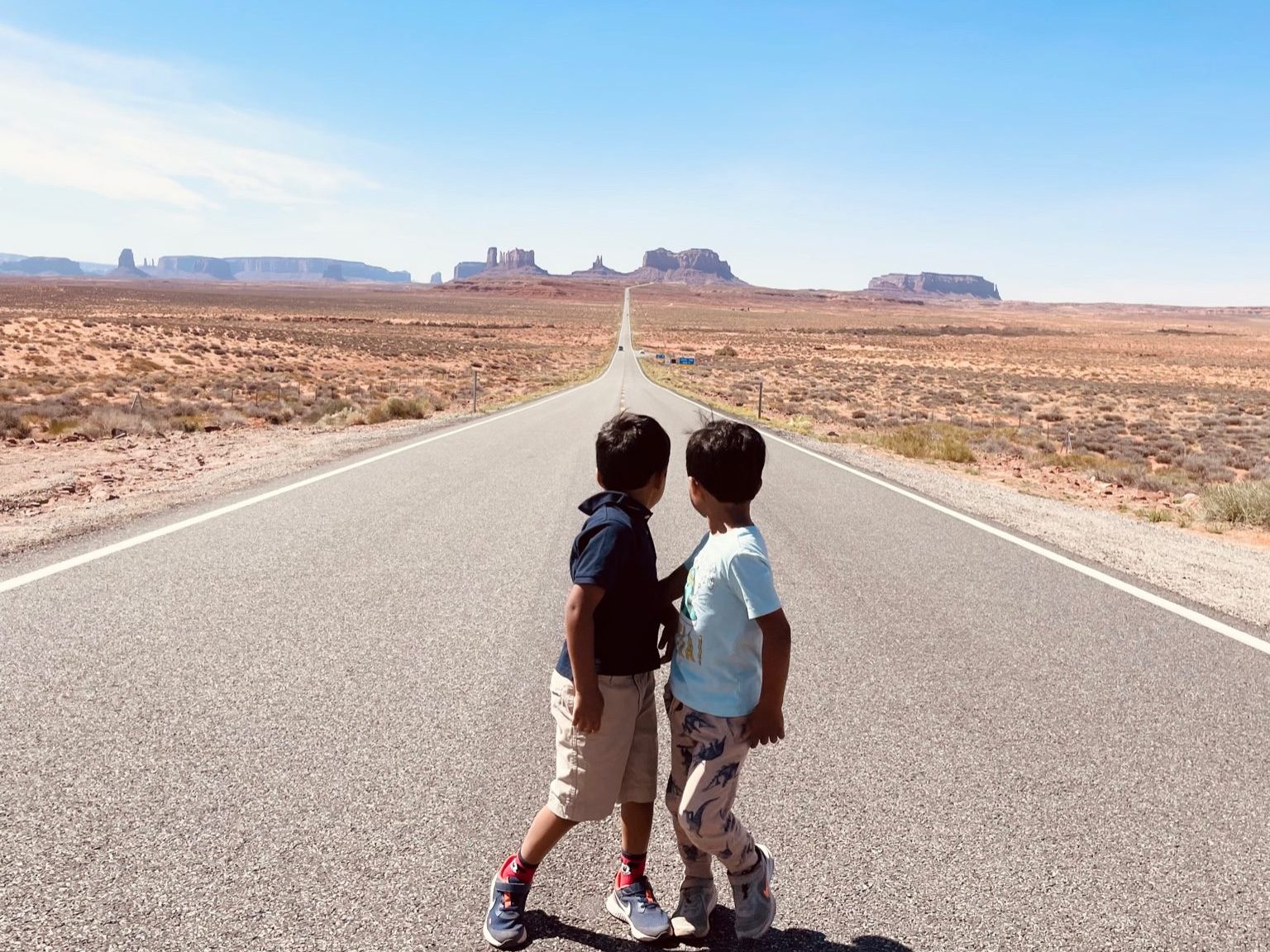 Monument valley from the iconic Highway 163 scenic drive - a must stop on any Utah road trip with kids