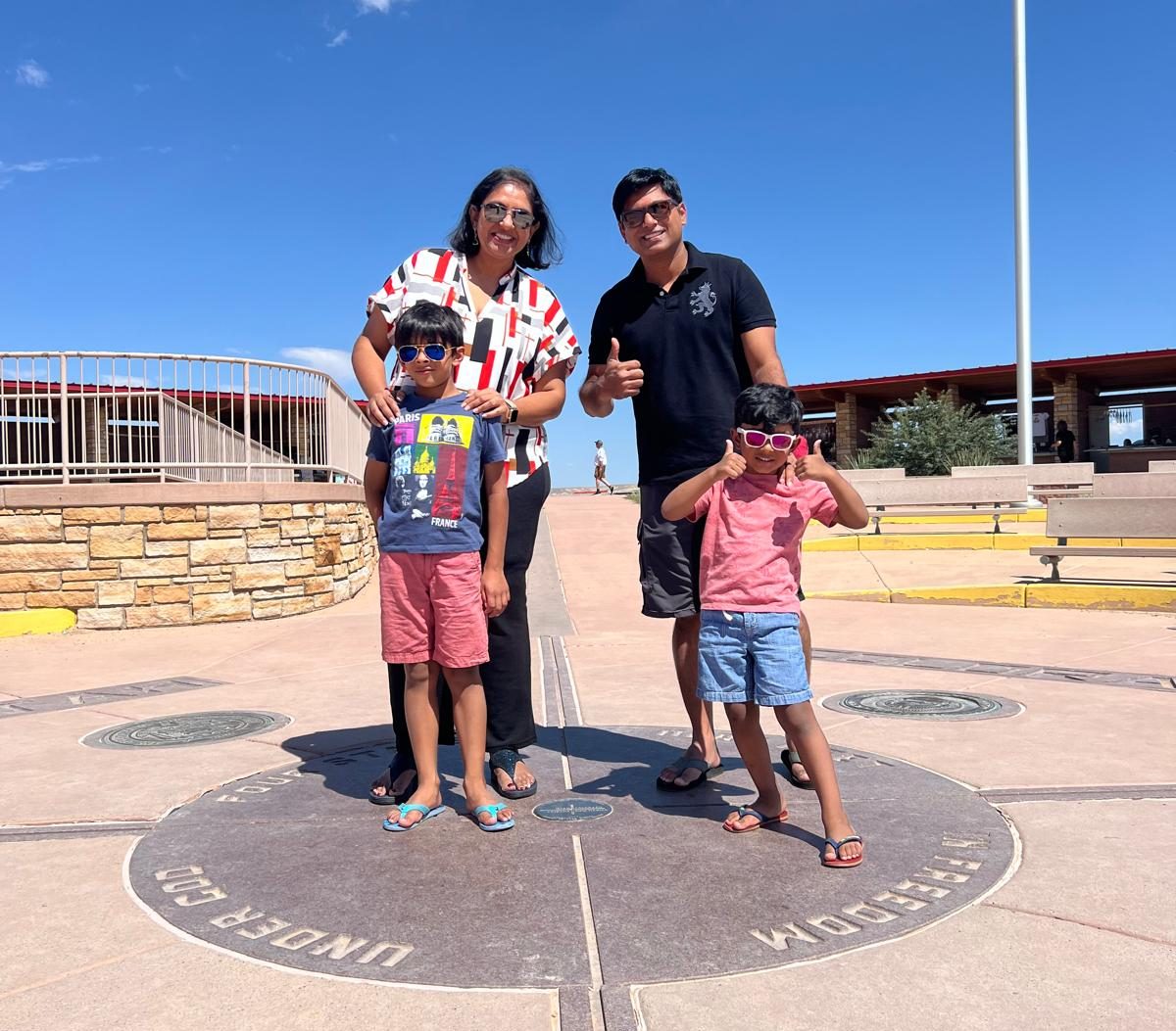 Picture at Four Corners to show our Utah Road Trip Planning Tips for Families