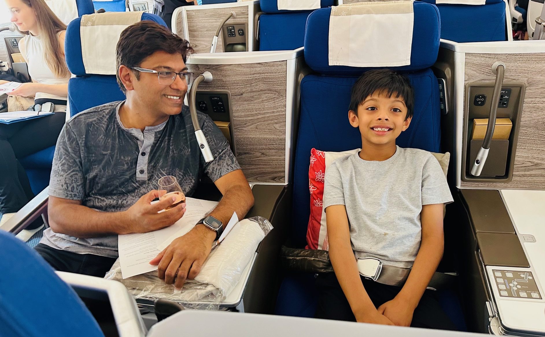 Business class flight using the best family travel credit card