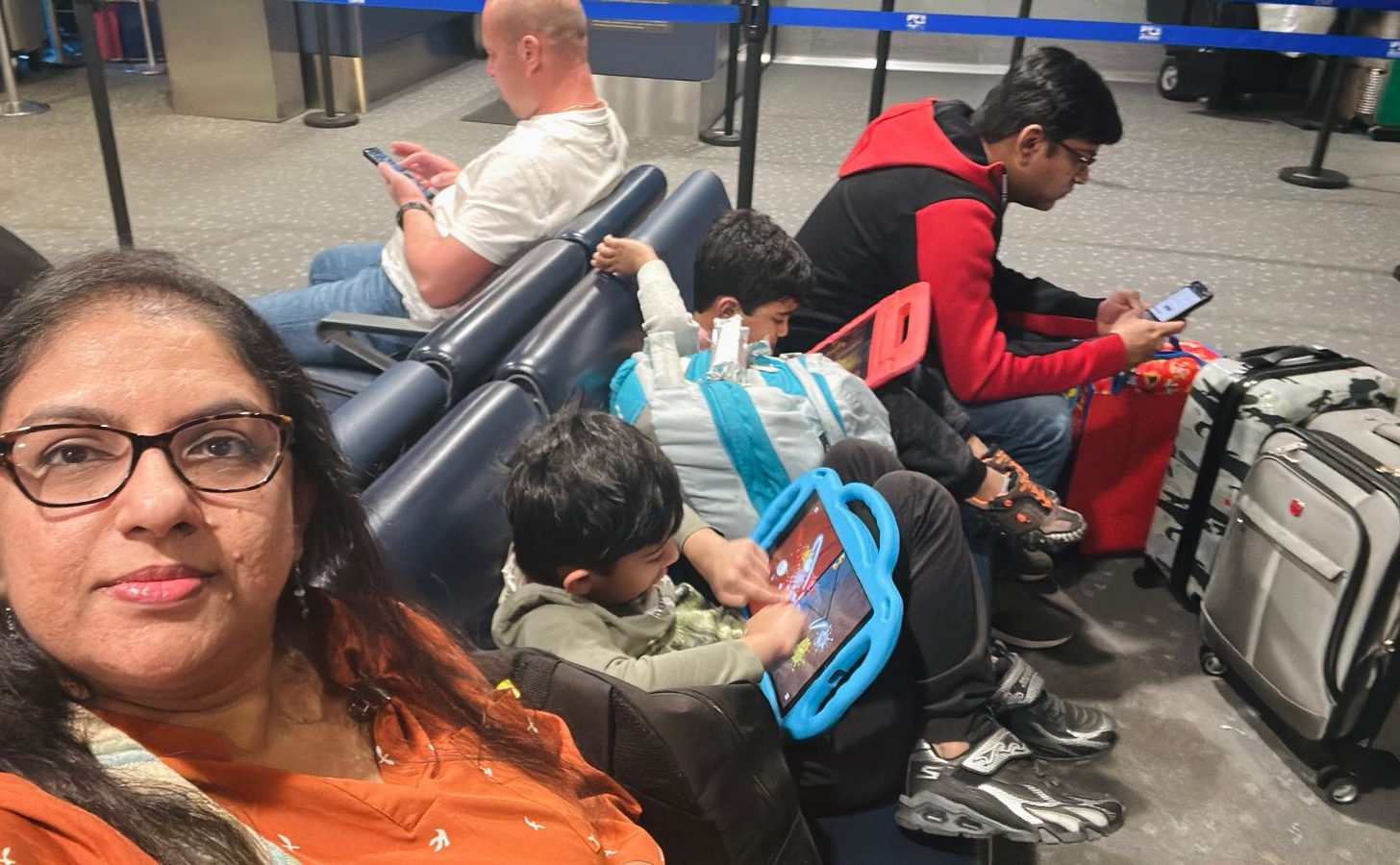 At Gate, selfie with Family with no Priority Pass Lounge available