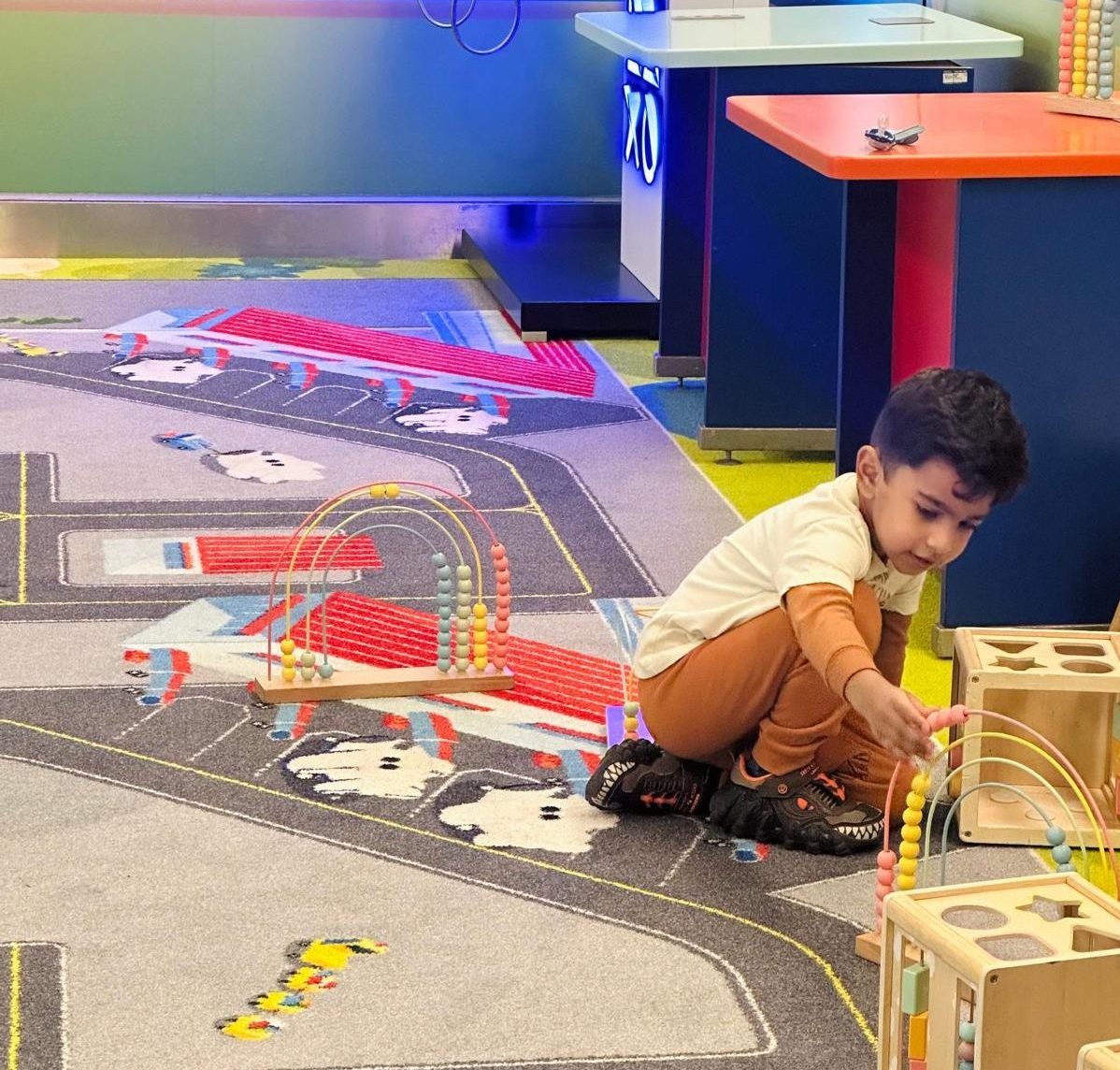 Child playing at a lounge's kid area