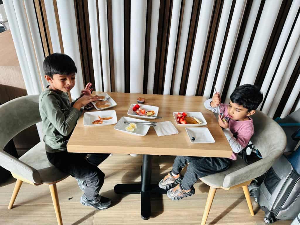 Kids relaxing from using Priority Pass Credit Card